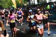 Runners are hosed down with water at the TCS London Marathon 2025 - Source: Getty